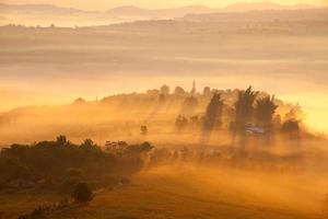 Misty morning sunrise in Khao Takhian Ngo View Point at Khao-kho Phetchabun,Thailand photo