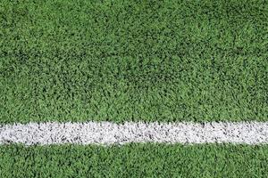 White stripe on the green football field photo