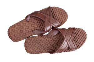 Brown rubber flip flops on a white background photo