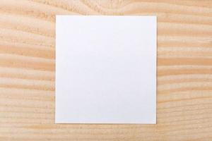 Blank paper on wood background photo