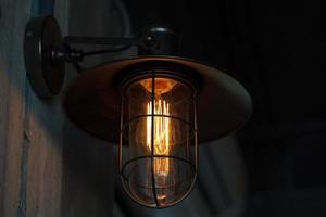 Classic edison light bulb on old wall