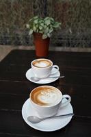 latte art coffee on wood background photo