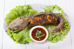 Grilled catfish on table photo