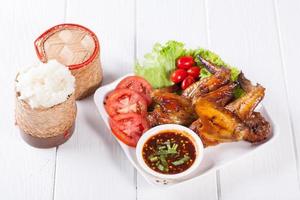 Grilled Chicken Wings with Red Spicy Sauce and Sticky Rice photo