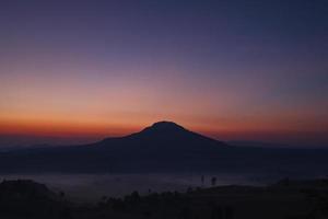 Misty morning sunrise in Khao Takhian Ngo View Point at Khao-kho Phetchabun,Thailand photo