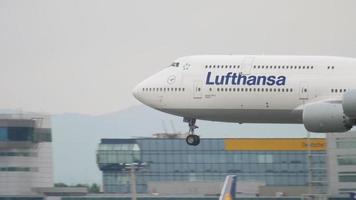 FRANKFURT AM MAIN, GERMANY JULY 20, 2017 - Lufthansa Boeing 747 landing at Frankfurt, Germany. Landing with the smoke of a huge Boeing Jumbo Jet video