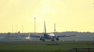 AMSTERDAM, THE NETHERLANDS JULY 25, 2017 - KLM Royal Dutch Airlines Boeing 737 PH BGO braking after landing at runway 06 Kaagbaan at sunrise. Shiphol Airport, Amsterdam, Holland video