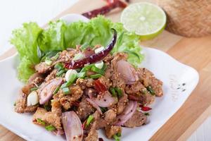 Spicy roasted pork salad , Thai food photo