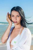 Woman holding seashells photo