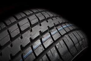 Tire isolated on black background photo