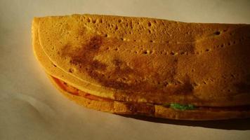 Three-stacked yellow thin sweet martabak photo