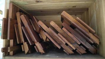 Stacks of small brown folding tables for learning the Koran photo