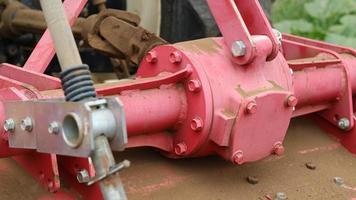 The iron corners of the motorbike that have been damaged hit the ground because they have been used too much on unpaved roads photo