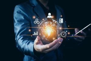 Businessman conducting online transactions with internet technology. Concept global data connection by metaverse technology , big data , search for information, e-commerce, online business. photo
