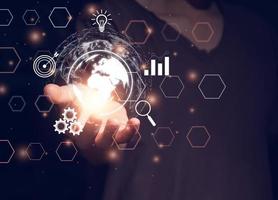 Person conducting online transactions with internet technology. Concept global data connection by metaverse technology , big data , search for information, e-commerce, online business. photo