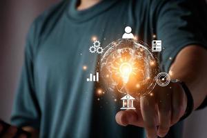 Businessman conducting online transactions with internet technology. Concept global data connection by metaverse technology , big data , search for information, e-commerce, online business. photo