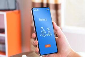 Person using smartphones for online transactions, delivery, online shopping, fast delivery, Express transport, ordering through apps, internet technology, easy access, smartphone screen. stay at home photo