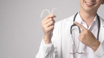 Portrait of male confident doctor over white background studio, healthcare and Medical technology concept. photo