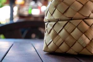 Bamboo wicker sticky rice basket used in local houses and restaurants. photo