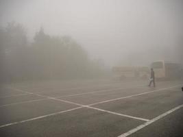 zhangjiajie China - 14 October 2018 Bus and Taxi car on the Tianzi mountain in Zhangjiajie National Forest Park in Wulingyuan District Zhangjiajie City China in the Foggy day. photo