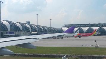 BANGKOK, THAILAND NOVEMBER 30, 2017 - Airplanes in Suvarnabhumi airport, view fom taxiing aircraft video