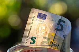 Euro banknotes in glass jar. photo