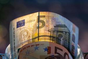 Euro banknotes in glass jar. photo