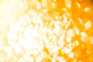 Bokeh Golden shiny glitter texture background. Happy new year and Christmas background. photo