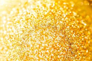 Golden shiny glitter texture background. Happy new year and Christmas background. photo