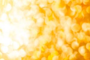Bokeh Golden shiny glitter texture background. Happy new year and Christmas background. photo