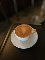 Hot coffee cup on table photo