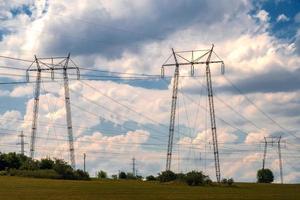 Rows of electrical towers and power lines. Horizontal view photo