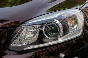 Headlight. LED headlamp of a modern car. Frontal lighting of highway vehicles photo