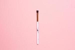 Beauty make up brushes on a pink background photo