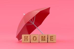 Red umbrella protecting home for house insurance concept photo
