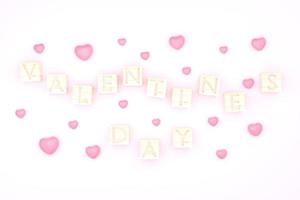 Wooden cube Valentime's dayand and pink hear backgground photo