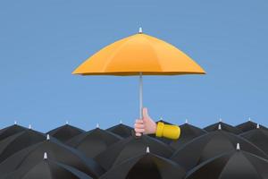Uniqueness and individuality. Hand holding a yellow umbrella among people with black umbrellas. photo