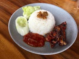 a plate of rice with sweet roasted duck photo