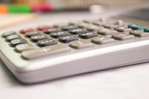 close up the button of calculator at office concept equipment Calculation of income, expenditure, calculation photo