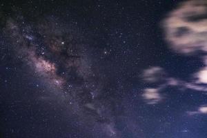 Milky way galaxy with cloud sky, Long exposure photograph.with grain photo