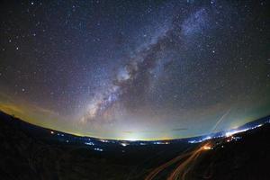 Milky way galaxy with knob stone ground is name Lan Hin Pum viewpoint at Phu Hin Rong Kla National Park in Phitsanulok, Thailand photo