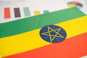 Ethiopia flag on graph background, Business and finance concept. photo