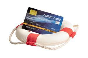 Financial crisis, lifeboat with credit card, assistance and security of finance. photo