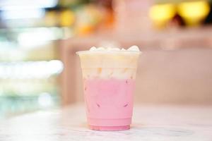 Pastel shades Pink milk with whipping cream. photo