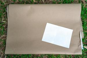 flipboard paper on the grass with a4 white paper size on the top, prepares for college student workshop. photo