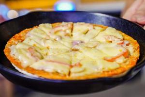 pizza ham tops up with supreme cheese and crab stick at the  Foodtrack event in Bangkok, Thialand. photo