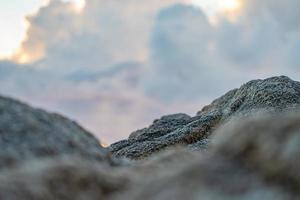 Close up to of Rock blur foreground with the cloudy sky. photo