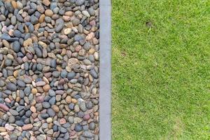 Separated Grasses texture and Rock with concrete cement line in the middle of it for 2 combination concept background between abound and arid. photo
