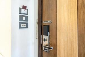 Door security smart lock and room switcher control platform on the wall beside the door in Thailand resort. photo