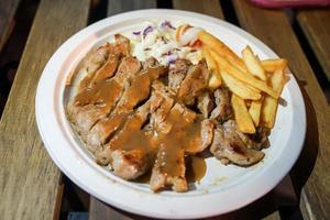 Steak and french fried food street by foodtruck, Bangkok, Thailand. photo